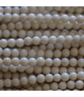 Bois pétrifié naturel 4 mm ivoire perle ronde A Chine