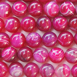 Agate 8/8.2 mm environ perle ronde fushia veinée (agate chauffée)