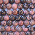Rhodonite 8/8.3 mm environ perle ronde veinée noire A+ Australie