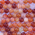 Cornaline naturelle mixte 6 mm environ perle ronde A+ Madagascar