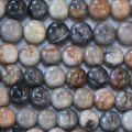 Jaspe Picasso 8/8.5 mm environ perle ronde noir/gris/moutarde USA