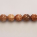 Pierre du soleil 10 mm environ perle ronde mixte A Afrique du Sud